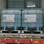 A fully loaded freight container with multiple Intermediate Bulk Containers (IBCs) filled with Eapearl Chem's chemical products, ready for transportation.