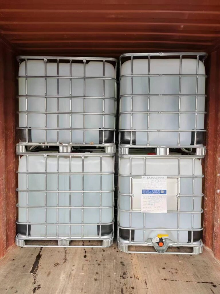 Intermediate bulk containers (IBCs) loaded inside a shipping container.