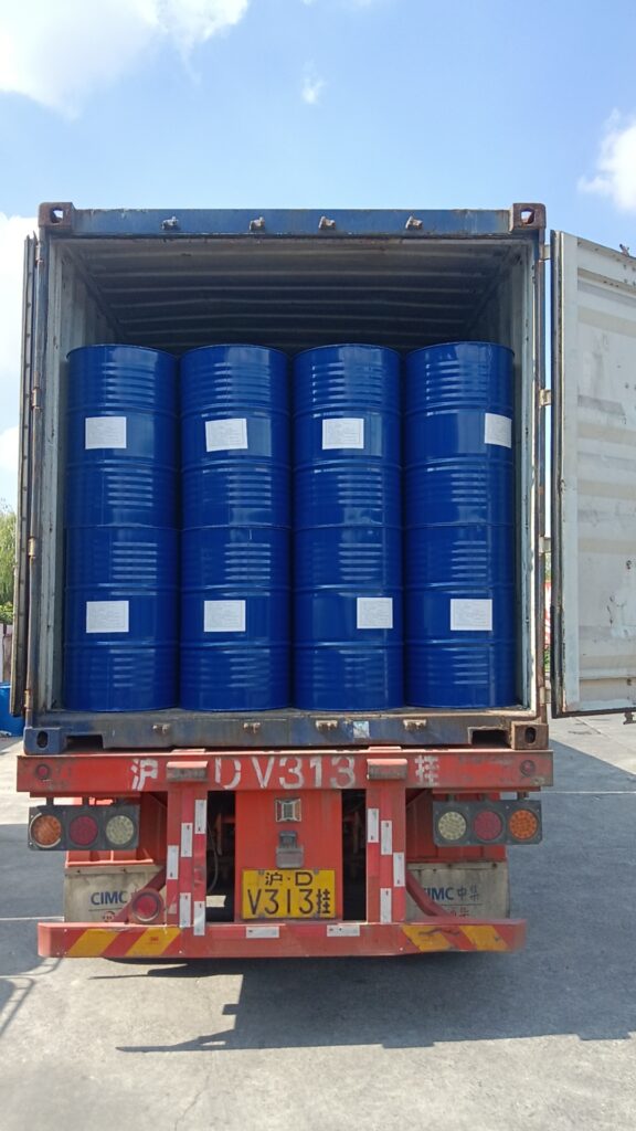 Loaded freight container with blue Eapearl chemical drums for export.