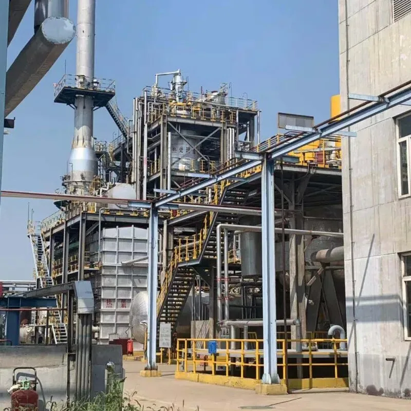 Industrial phthalic anhydride plant with complex piping and distillation towers.