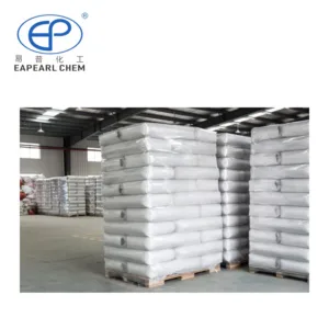 Stacked 25kg bags of Eapearl powder on wooden pallets in a warehouse.