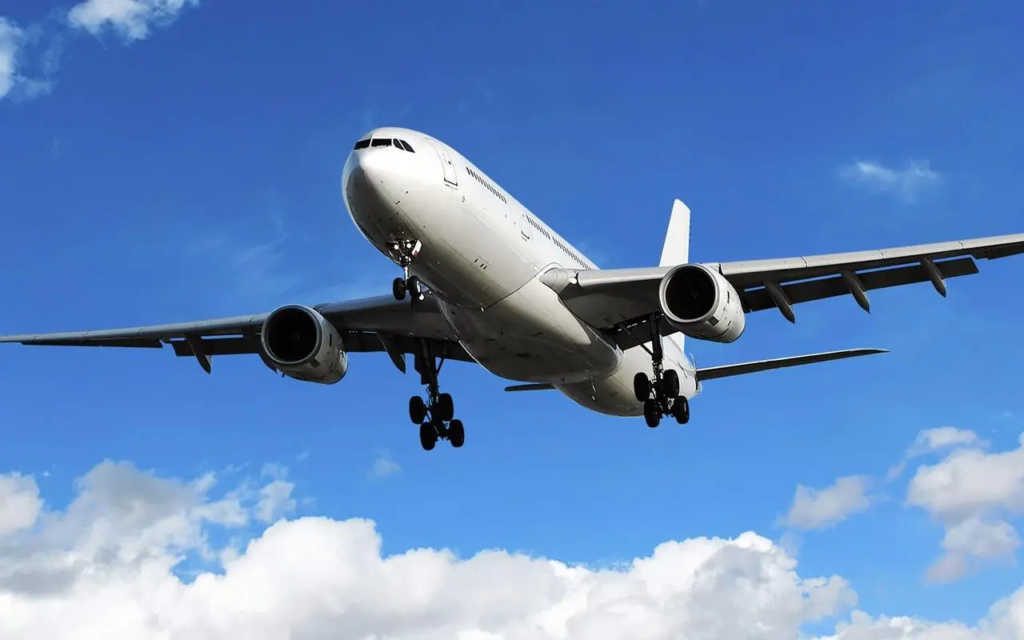 Commercial airplane landing on a clear day, used for illustrating the application of isopropanol as a deicing agent in aviation.