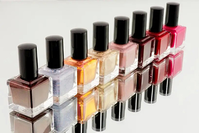 Assortment of nail polish bottles in various colors.